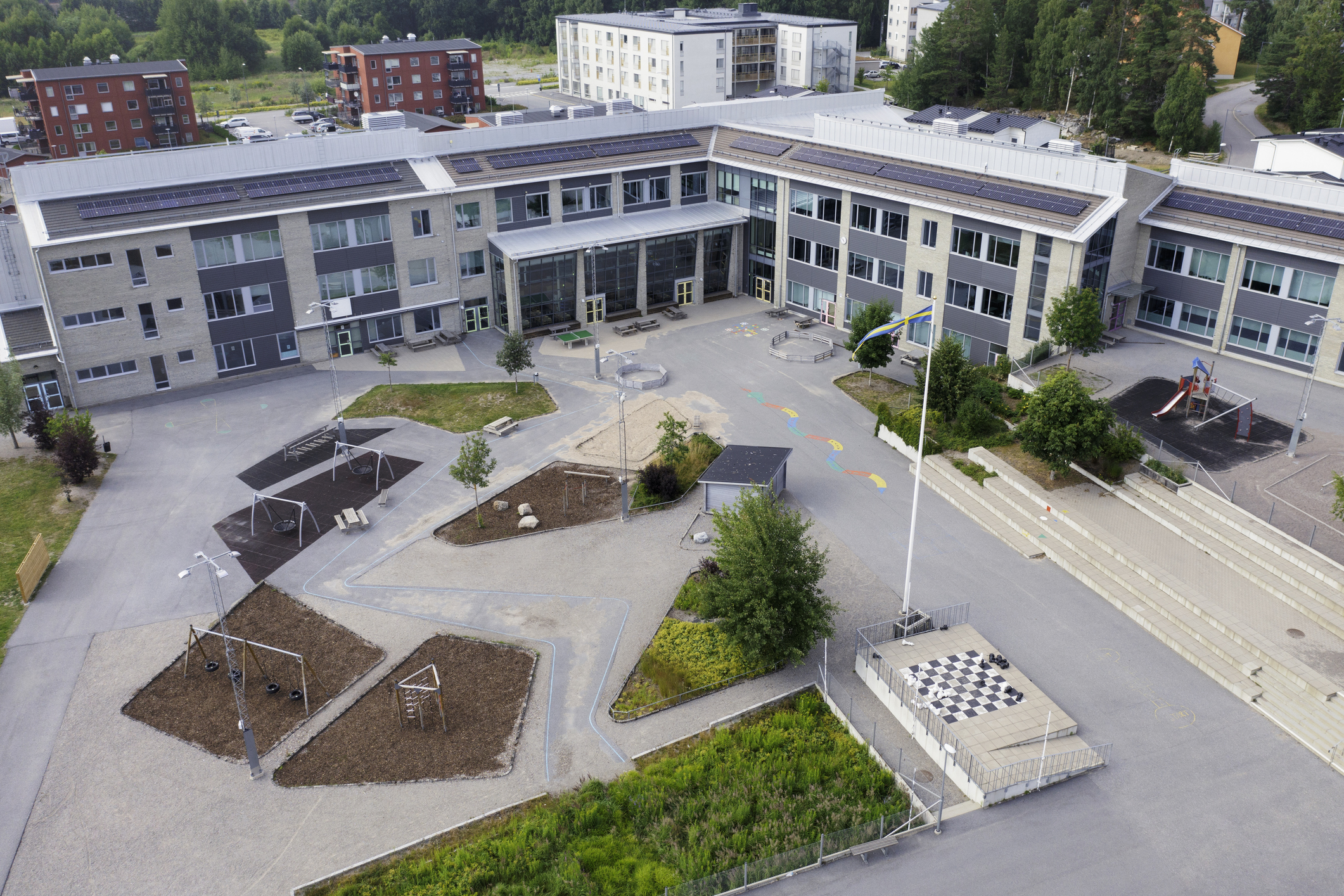 xterior of a school building and schoolyard in Stockholm, Sweden.